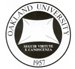 Round Oakland University seal with text on the outside and a white with the words
