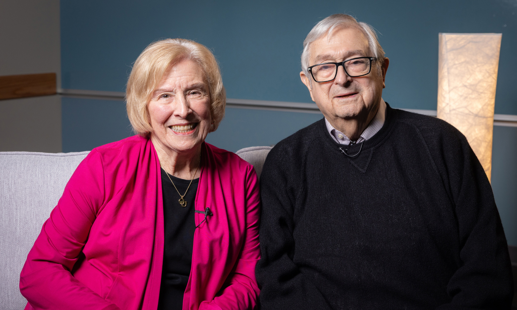 Male and female sitting inside