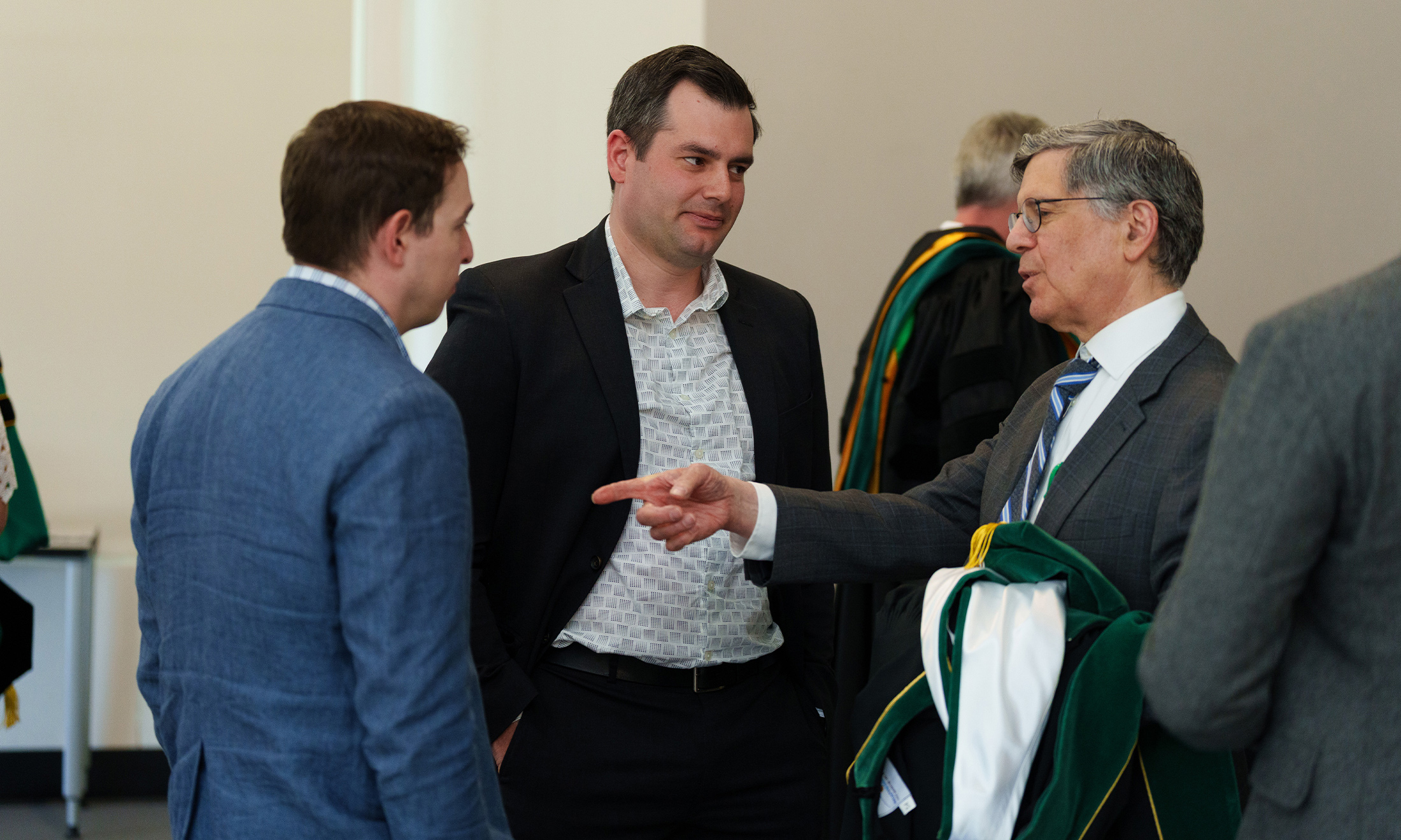 An image of three people chatting