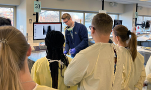 An OUWB alum teaching in the anatomy lab