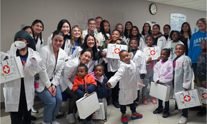 Participants in the Reach Out to Youth pose for a pic