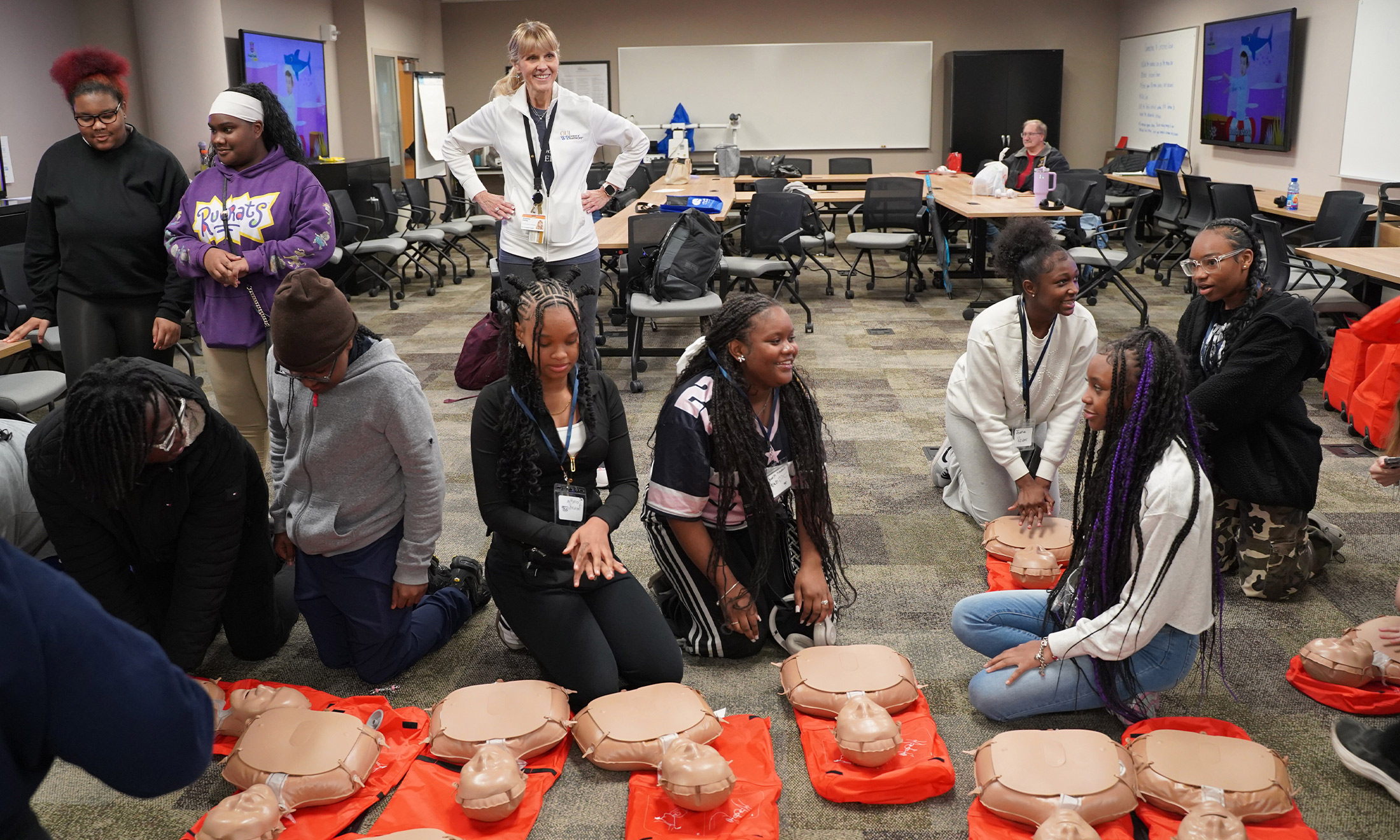 An image of students practicing CPR