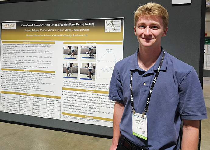 Garrett Belding with his research poster