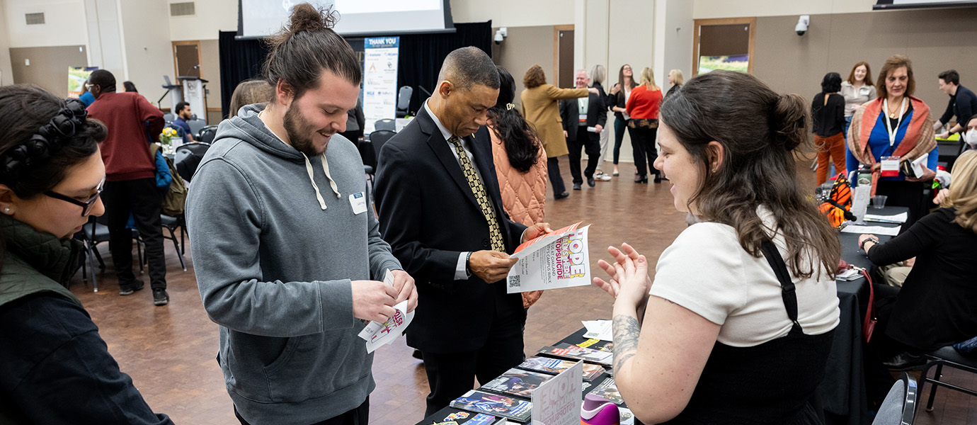 people looking at materials