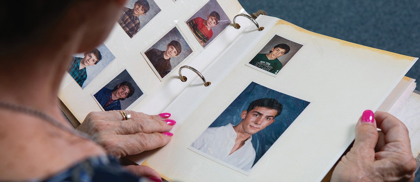 Hands flipping through photo album