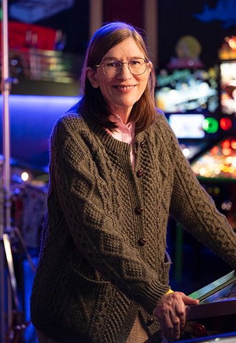 A person standing in an arcade