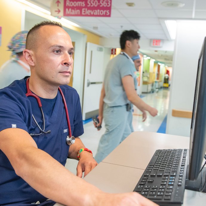 A nurse working on a computer in the hospital