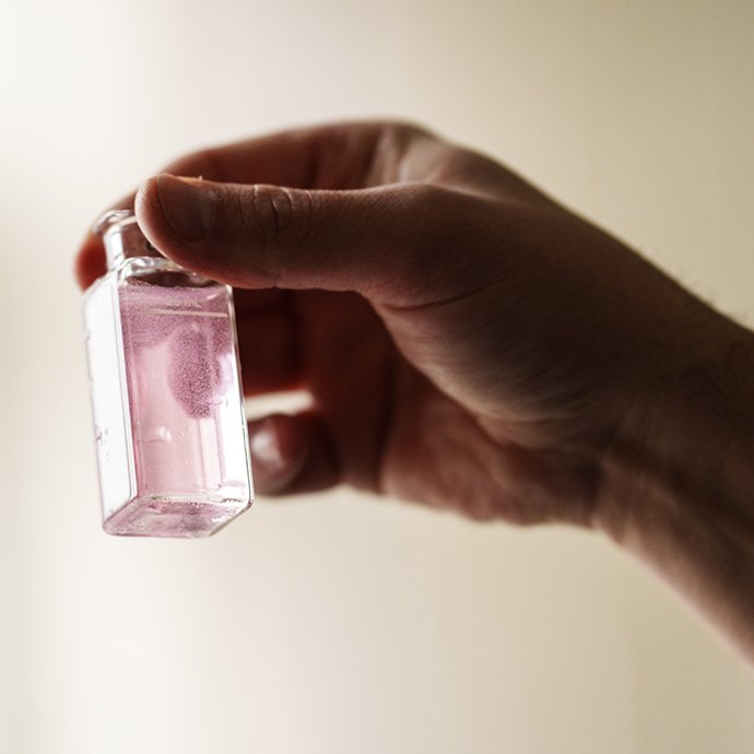 A vial of pink water