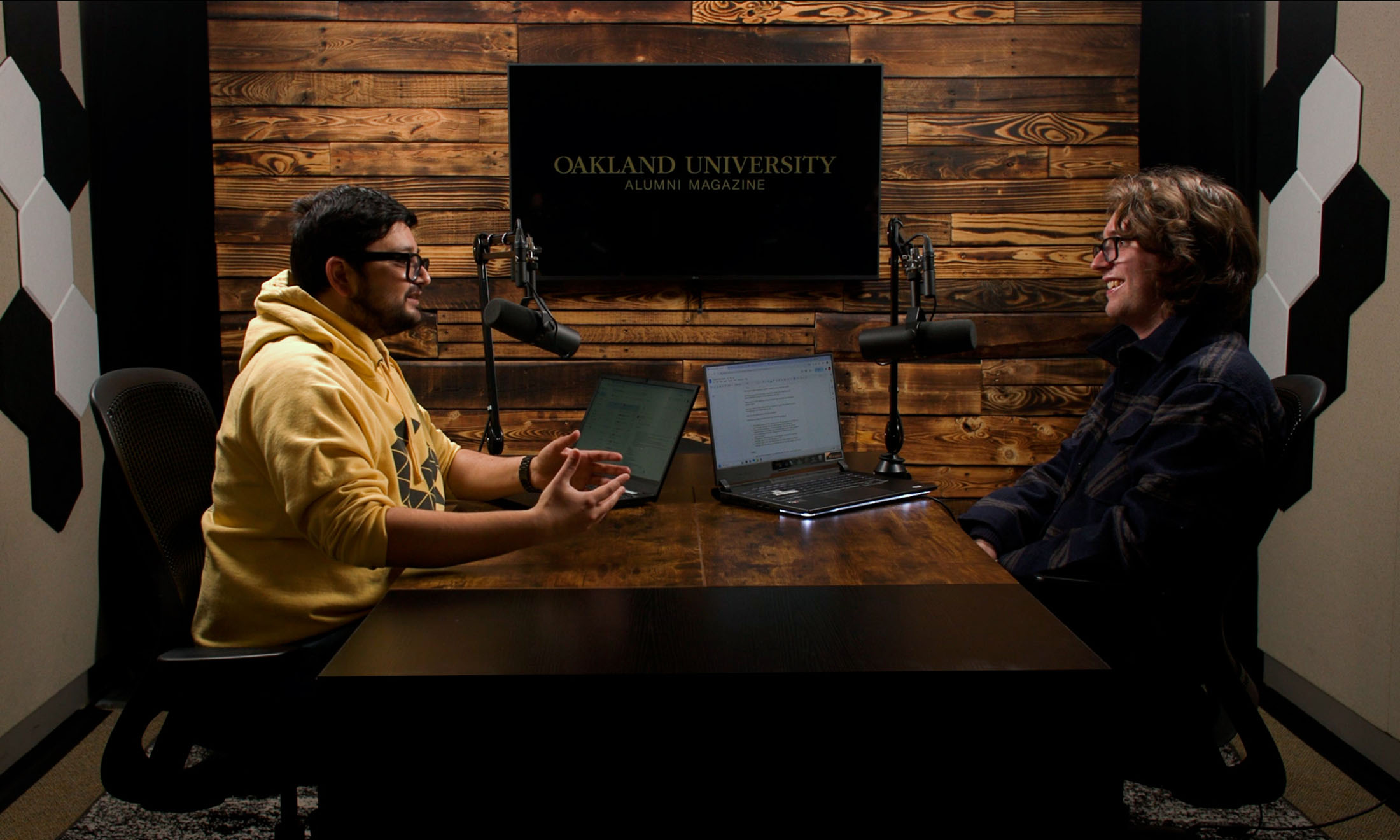 Two men sitting at podcast booth