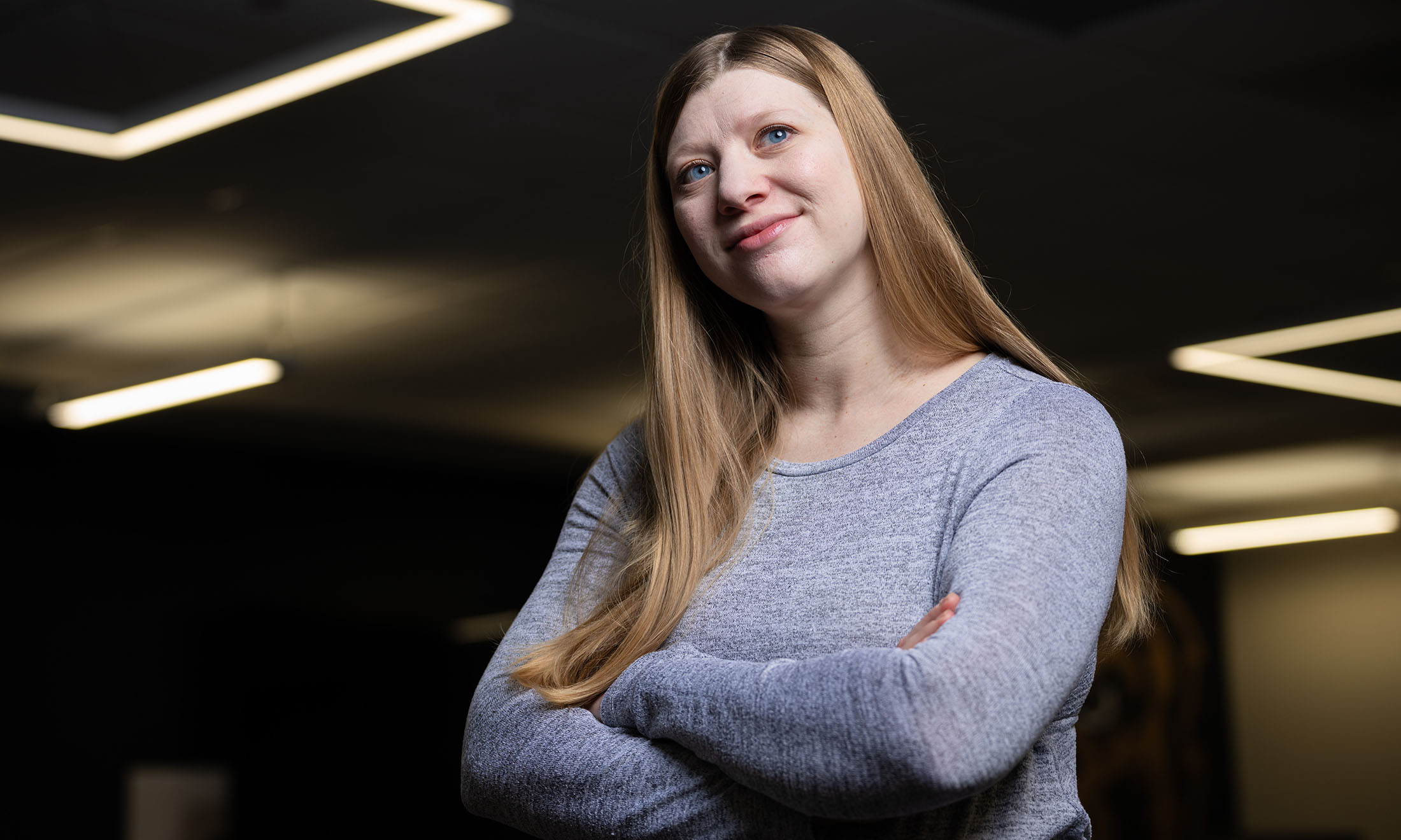 Woman smiling with arms crossed