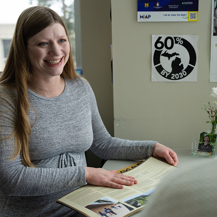 Woman at desk smiling