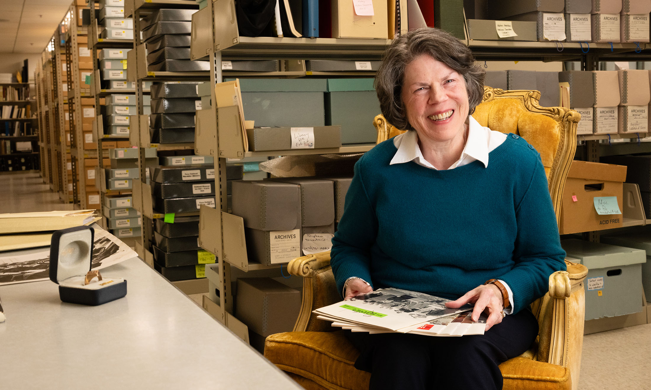 Woman smiling holding book