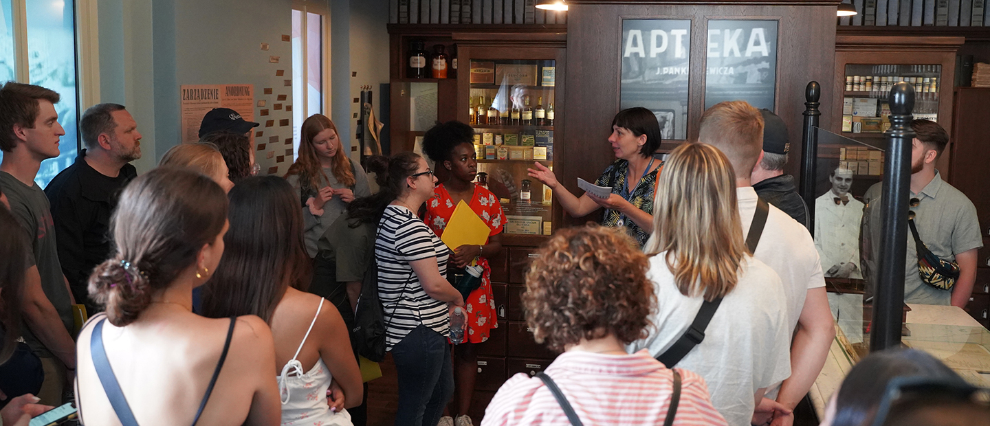 An image of OUWB students at an old pharmacy in Krakow Poland