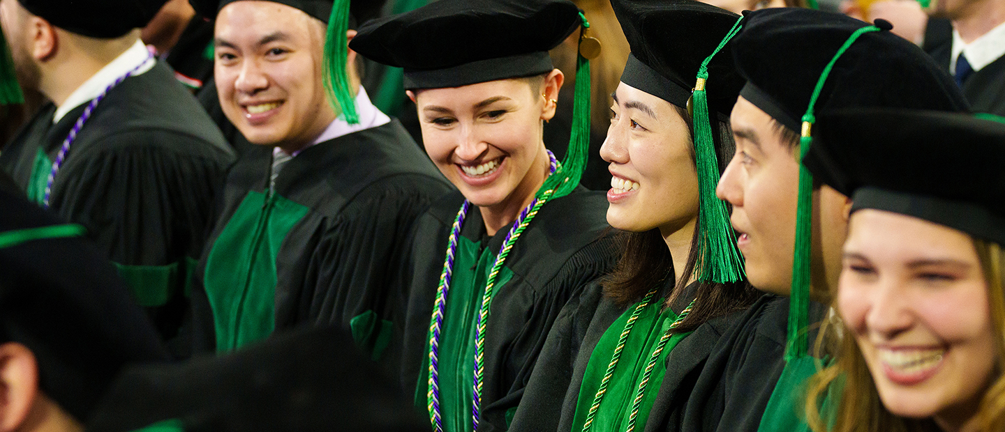 An image of OUWB students smiling at commencement