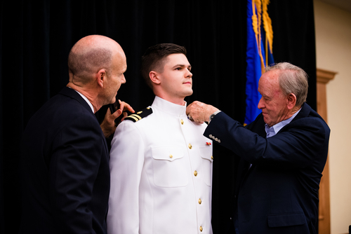 An image of a military student getting pinned
