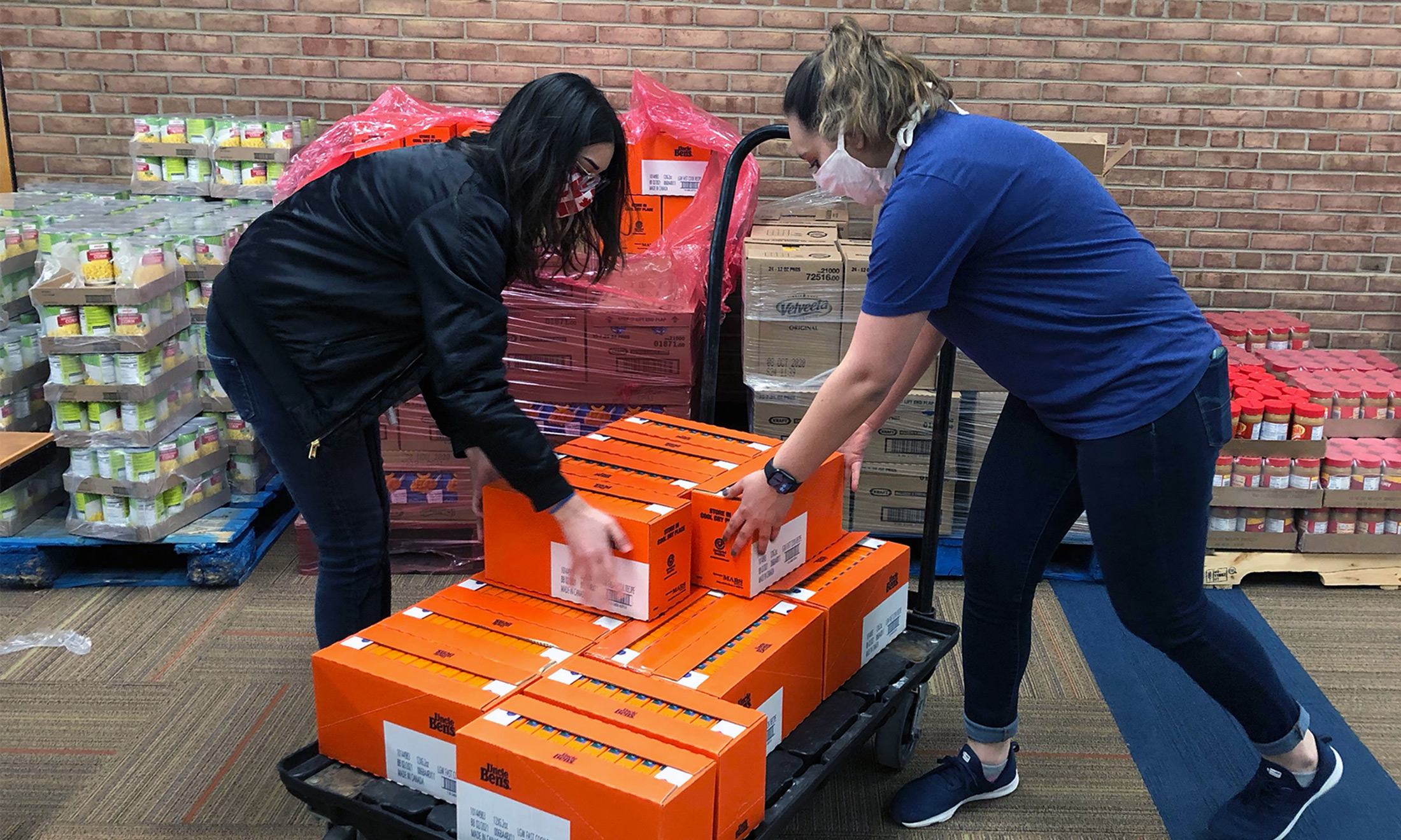 An image of students loading a cart