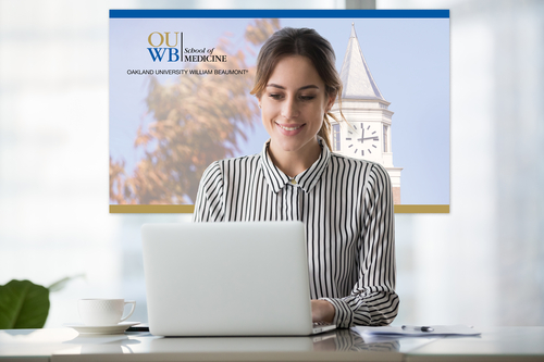 An image of a student at a laptop