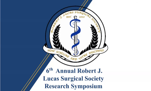 An image of a sign advertising the symposium