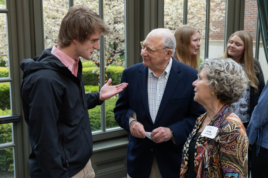 An image of Andrew Eibling talking with donors