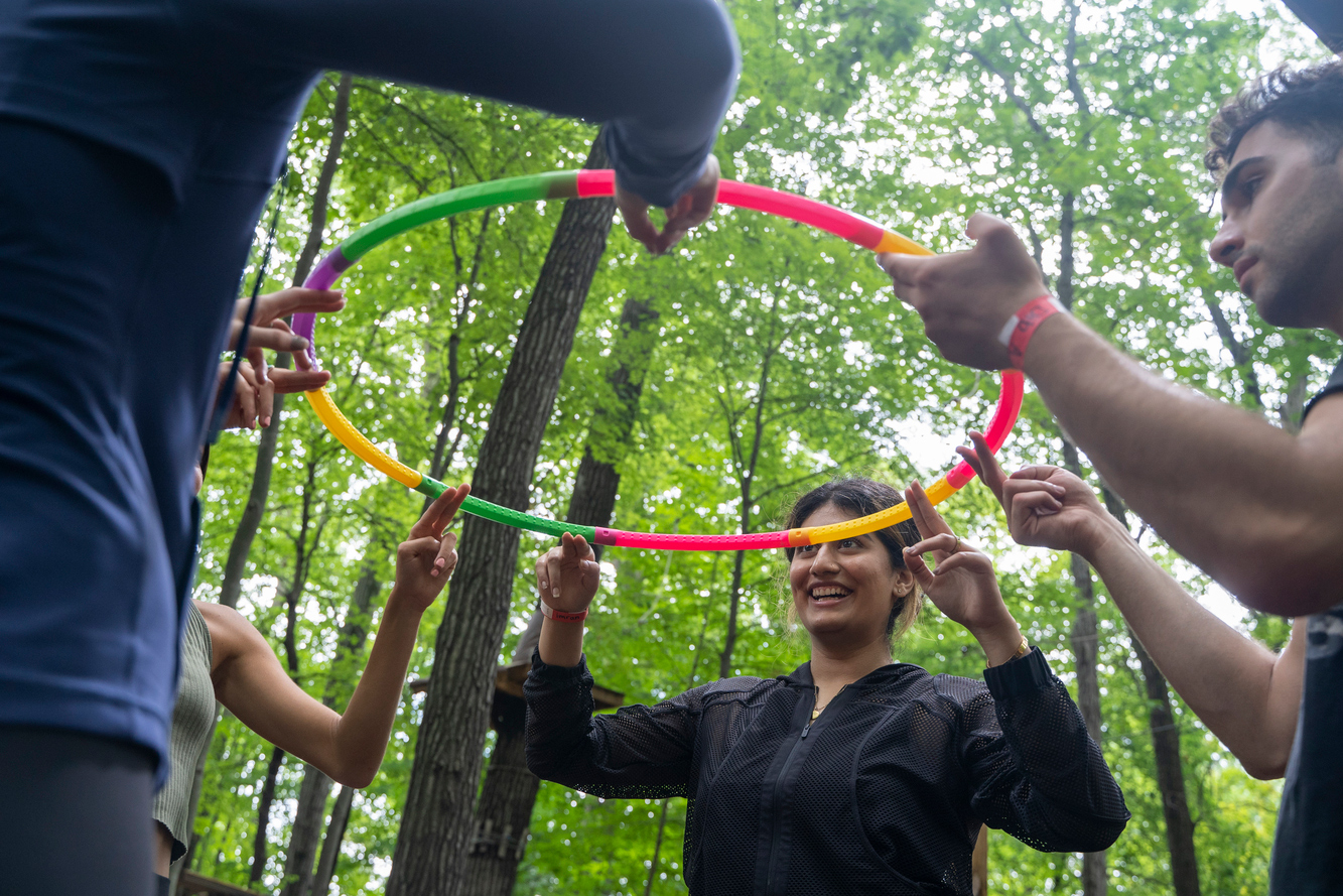 An image of students holding a hula hoop