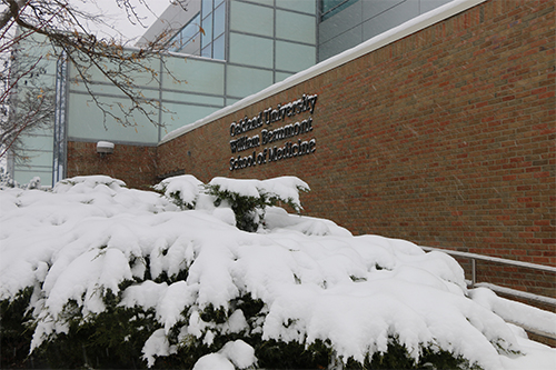 An image of snow outside of O'Dowd Hall