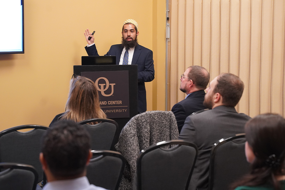 An image of a student at a podium