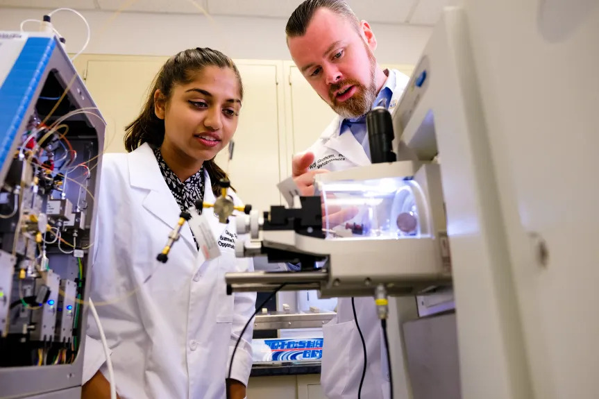 An image of Dr. Graham and a student