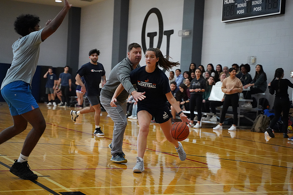 An image of people playing basketball