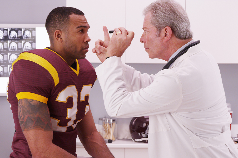 An image of a football player and a doctor