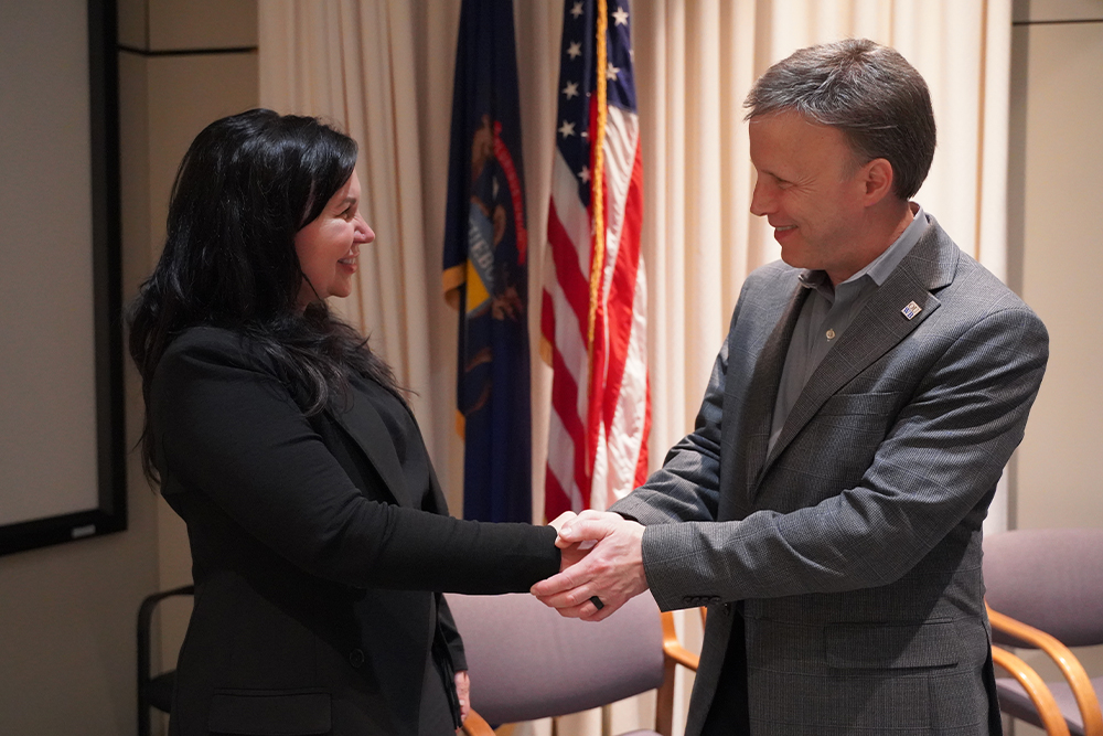 An image of Drs. Bauer and Carpenter shaking hands