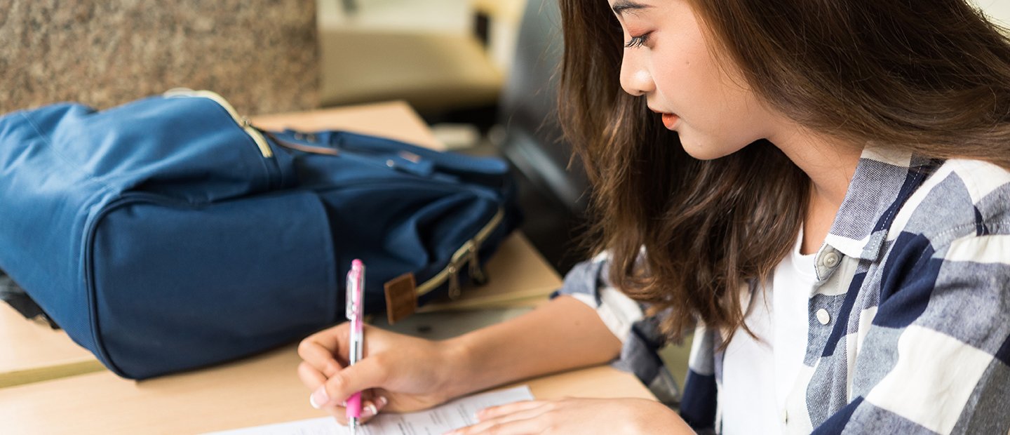 Student doing work at a table