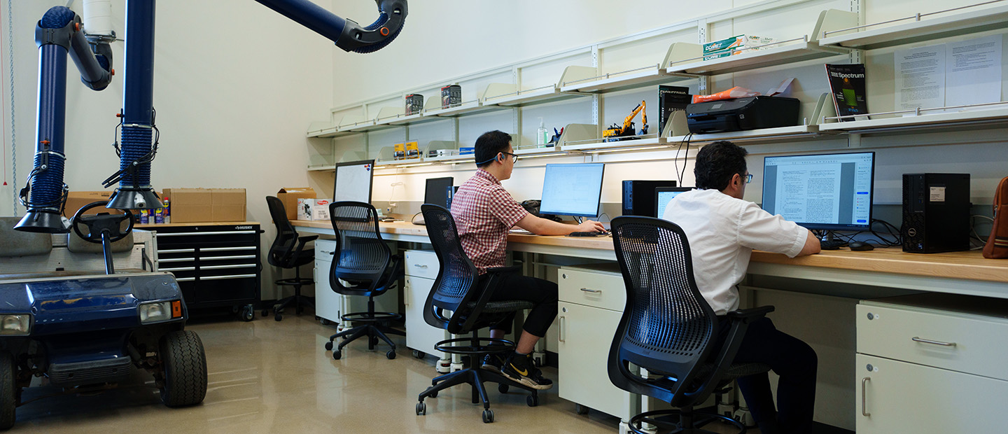 Two men working in an engineering lab at Oakland University