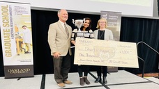 Shweta Kapur receiving an award for her presentation.