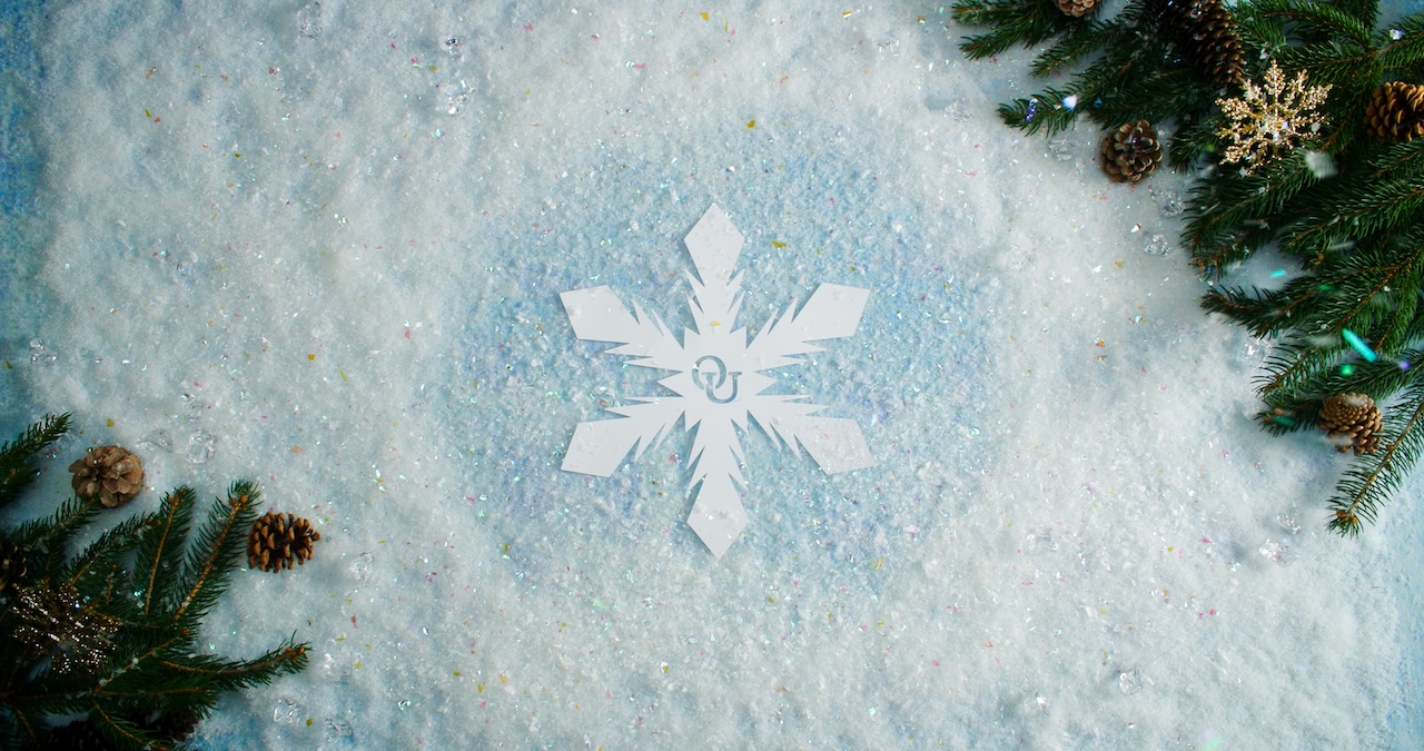 A snowflake with O U in the middle of it